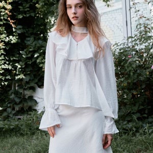 [르니나] ELENA frill tie blouse_WHITE