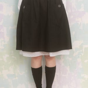 [나이엔] 빅 포켓 미디 스커트 NASS25SK03