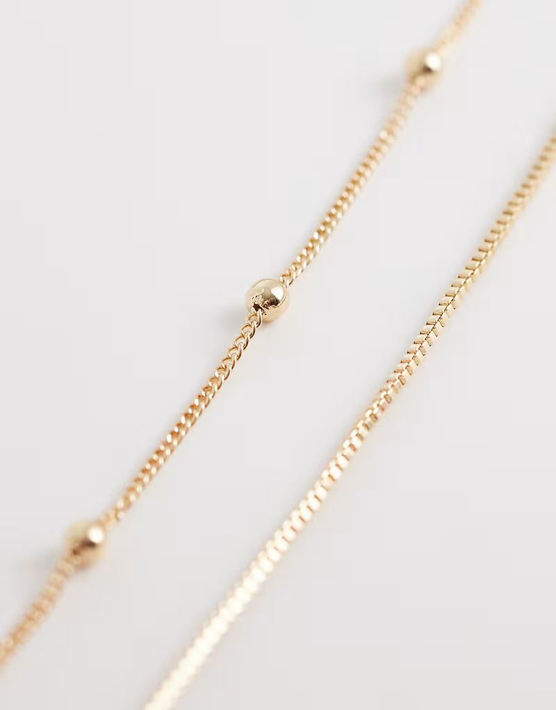 아소스 골드톤 다중 체인 목걸이 Mehrreihige Bauchkette in Goldoptik mit Kugel und Stabdetails 210112322G 152657252
