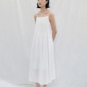 [스텝어라운드] Pintuck Button Slip Dress_WHITE SA26SMOP02WH
