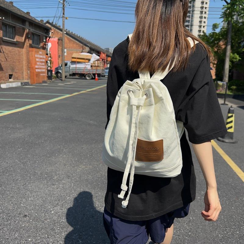 복조리백팩 캔버스 경량 대학생 블랙 카키 화이트 보부상 20대 캠퍼스룩 끈 스트링 데일리백 여행 버킷백