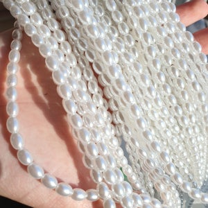 잔기스에 강한 양구멍 타원형진주구슬 화이트 아이보리